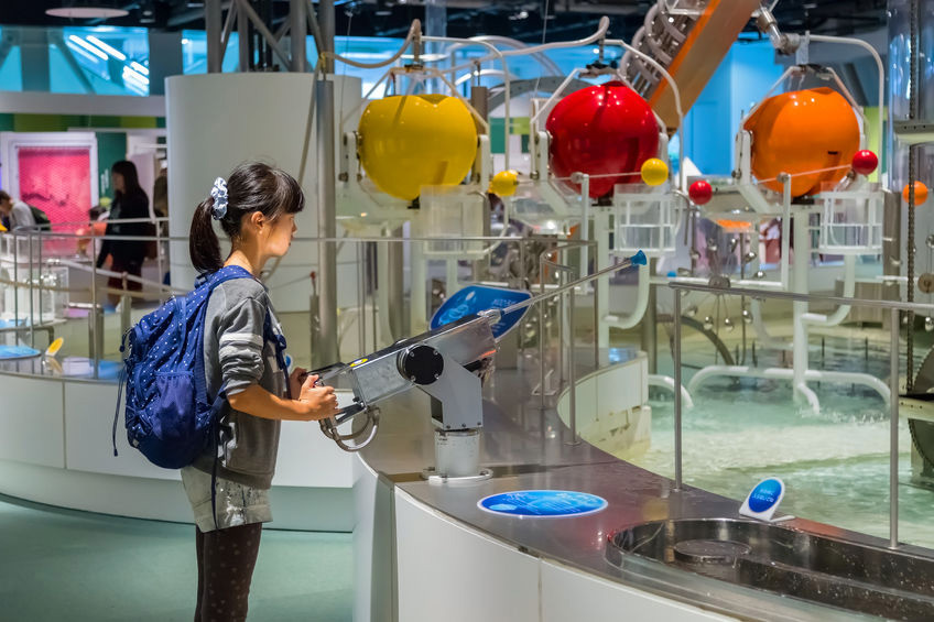 Child playing at the planetarium
